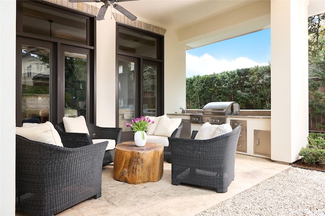 view of patio / terrace featuring ceiling fan, area for grilling, a grill, and sink