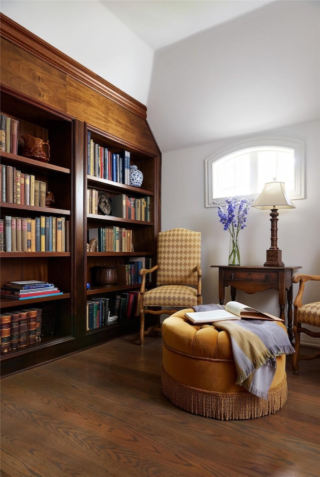 sitting room with lofted ceiling and dark hardwood / wood-style flooring