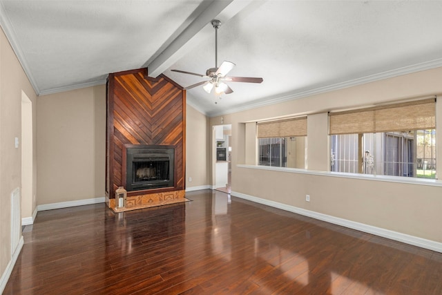 unfurnished living room featuring crown molding, ceiling fan, vaulted ceiling with beams, dark hardwood / wood-style floors, and a large fireplace