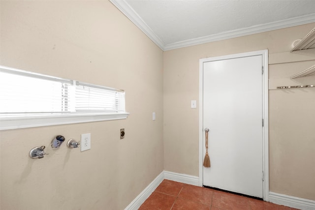 laundry room with ornamental molding, hookup for an electric dryer, and tile patterned flooring