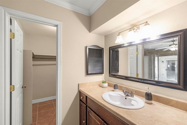 bathroom featuring vanity, crown molding, and tile patterned floors