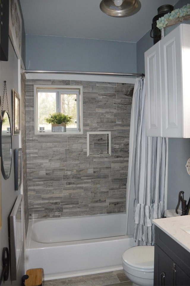 full bathroom with vanity, toilet, and shower / bath combo with shower curtain