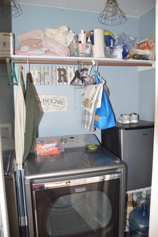 washroom featuring washer and dryer