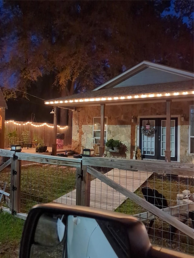 view of side of property with a porch