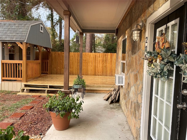 view of patio featuring cooling unit and a wooden deck