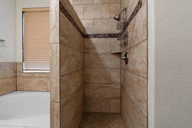 bathroom featuring shower with separate bathtub