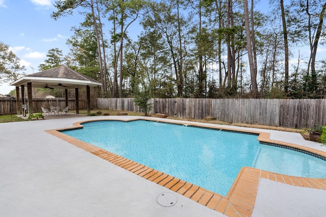 view of swimming pool with a gazebo, ceiling fan, and a patio area