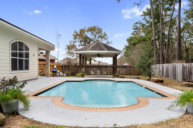 view of swimming pool with a gazebo, a patio area, and ceiling fan