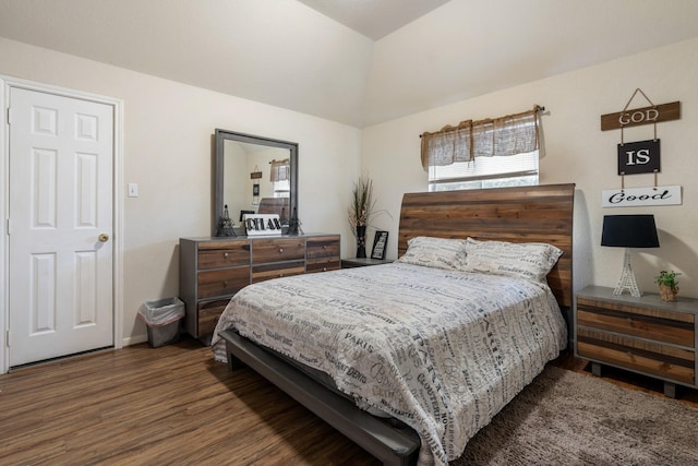 bedroom with dark hardwood / wood-style flooring