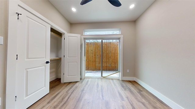 unfurnished bedroom with ceiling fan, light hardwood / wood-style flooring, and access to outside