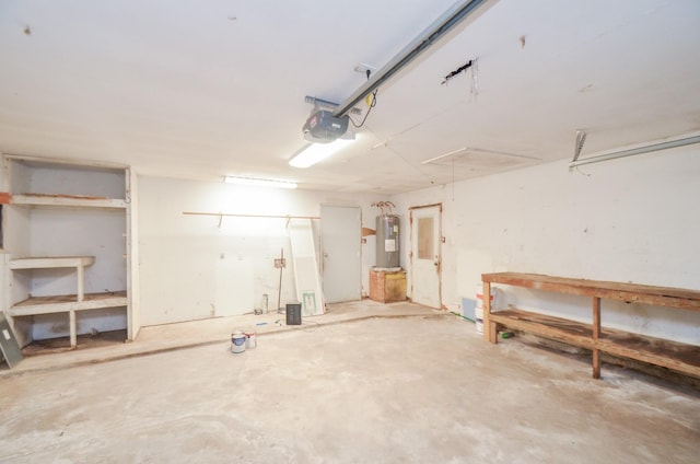 garage featuring a garage door opener and electric water heater