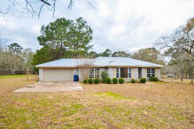 view of front facade with a garage and a front lawn