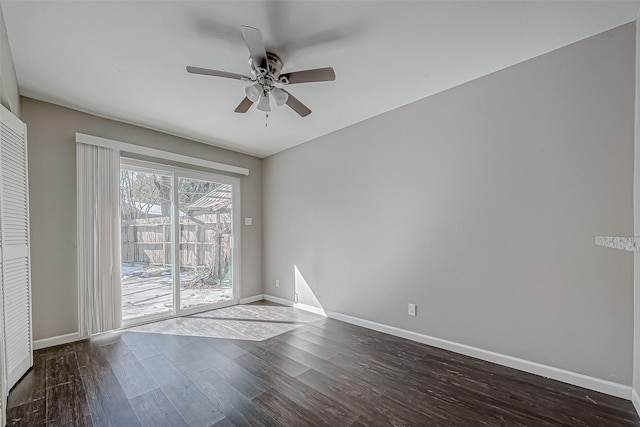 empty room featuring dark hardwood / wood-style floors and ceiling fan