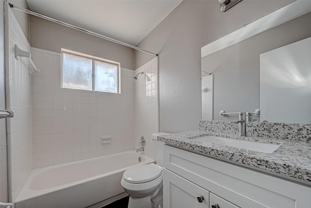 full bathroom featuring vanity, toilet, and tiled shower / bath combo