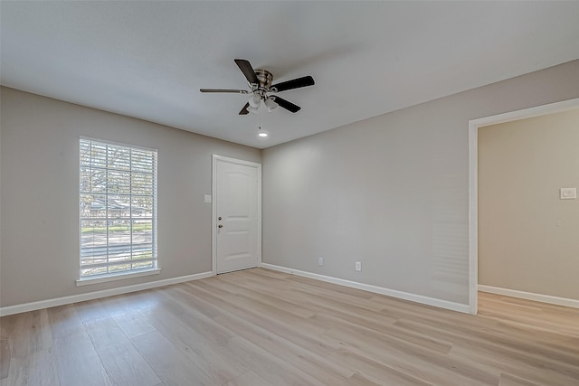 spare room with ceiling fan and light hardwood / wood-style flooring