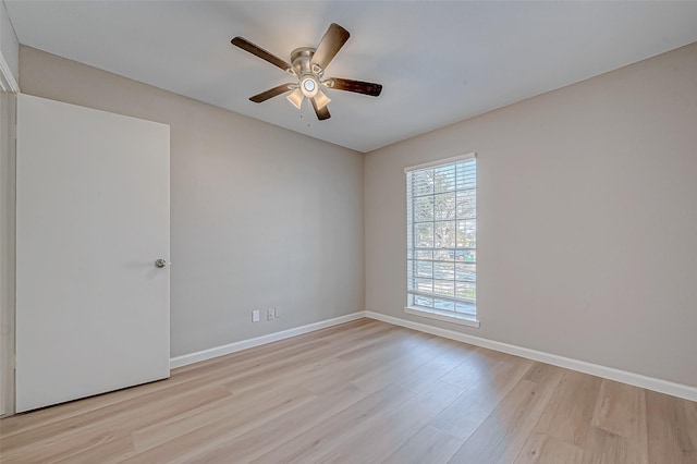 spare room with ceiling fan and light hardwood / wood-style floors