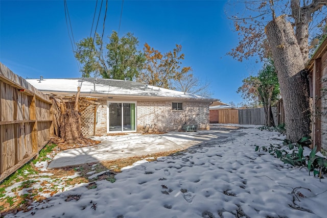 view of snow covered house