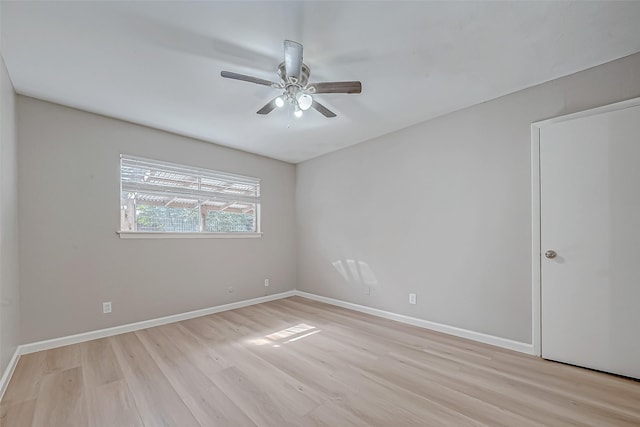 empty room featuring light hardwood / wood-style flooring and ceiling fan