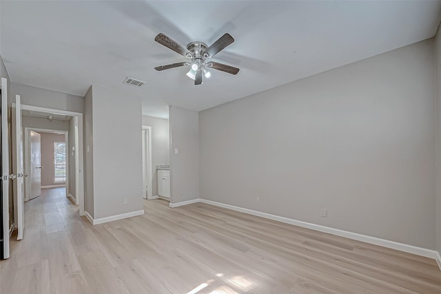 empty room featuring light hardwood / wood-style flooring and ceiling fan