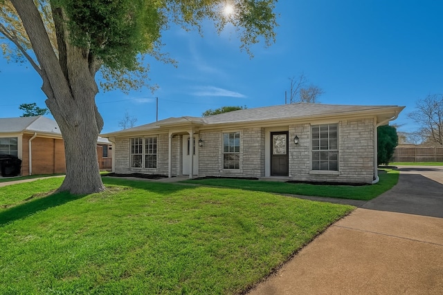 7315 Housman St, Houston, TX 77055 - ranch-style home with a front yard and stone siding