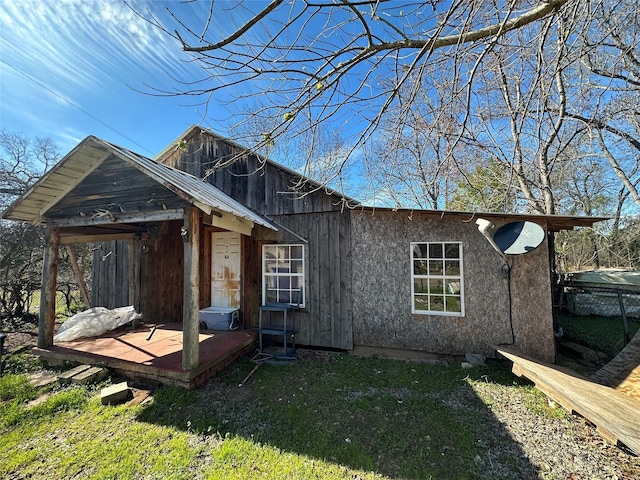 view of side of home featuring a lawn