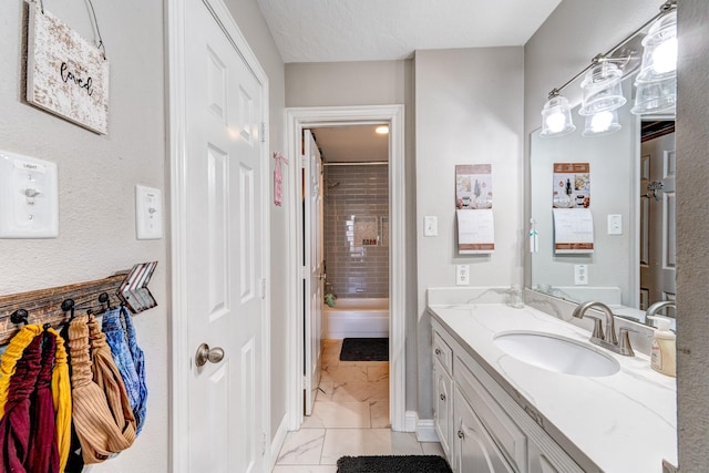 bathroom featuring vanity and a tile shower