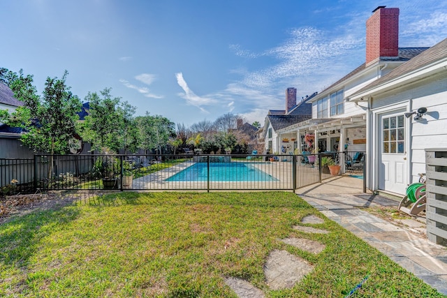 view of pool featuring a yard and a patio