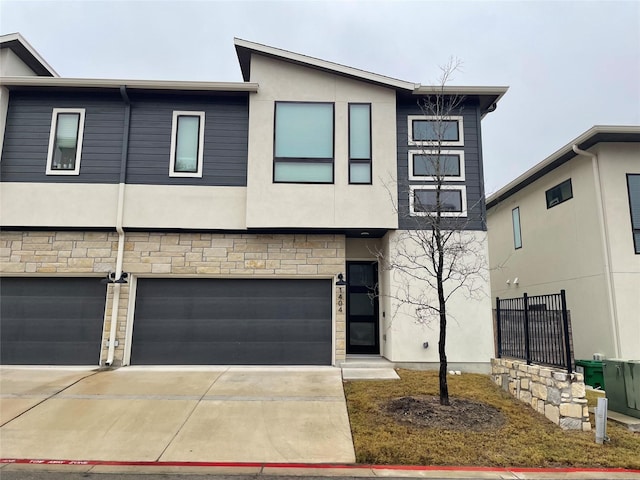 townhome / multi-family property featuring a garage