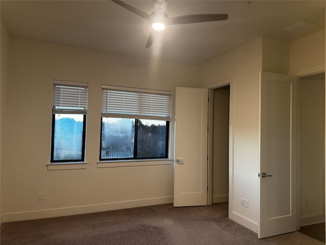 unfurnished bedroom with carpet flooring and ceiling fan