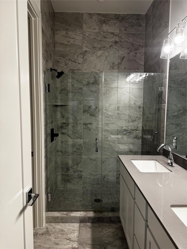 bathroom with vanity, an enclosed shower, and tile walls