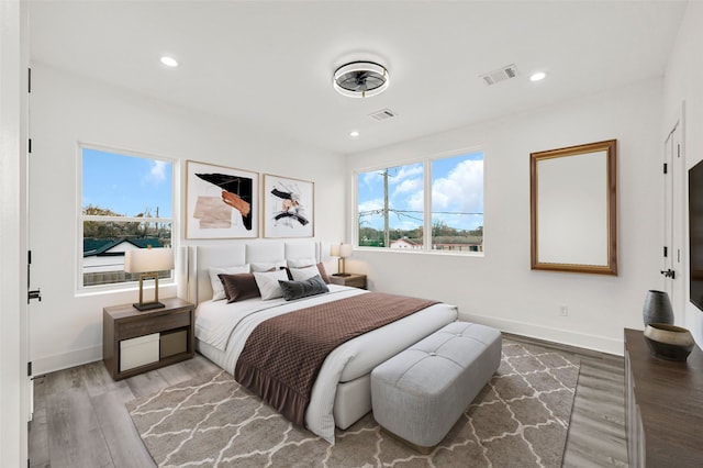 bedroom with hardwood / wood-style flooring