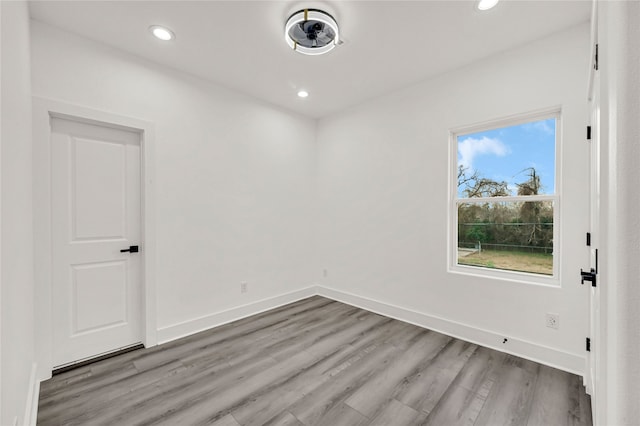 spare room featuring light hardwood / wood-style floors