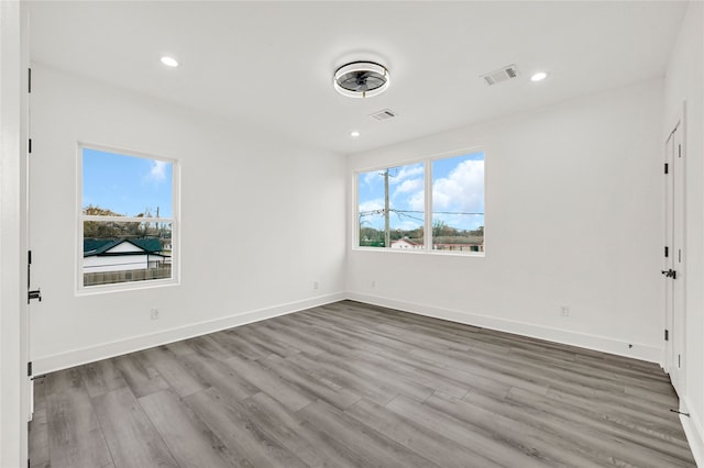 spare room with hardwood / wood-style flooring