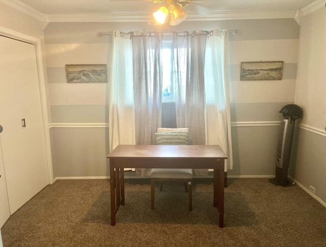 dining room featuring dark colored carpet, ornamental molding, and ceiling fan