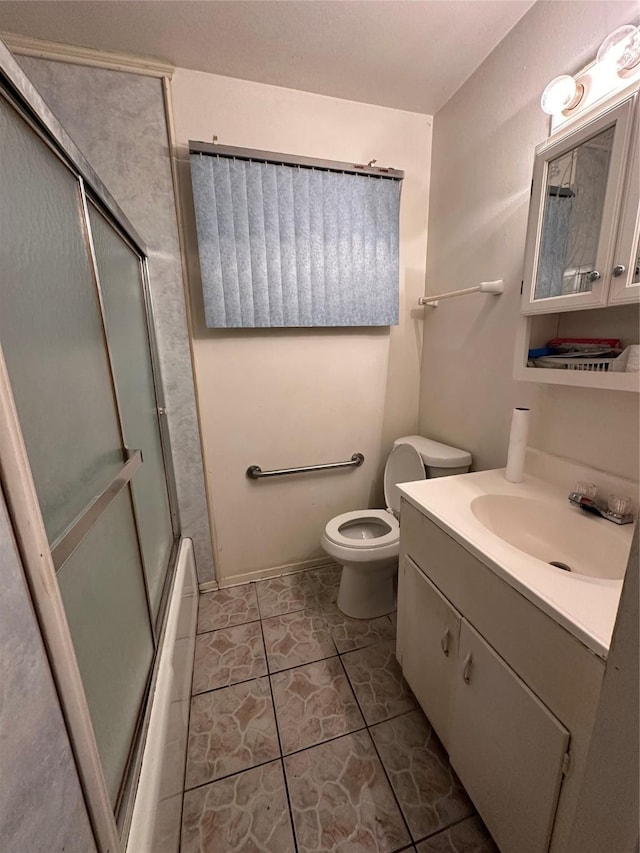 full bathroom with toilet, vanity, bath / shower combo with glass door, and tile patterned flooring