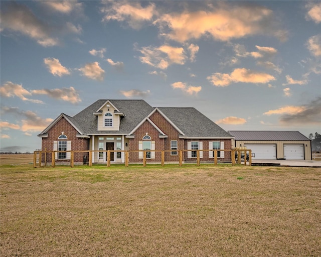 craftsman inspired home with a garage and a lawn