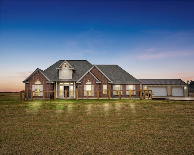 craftsman inspired home featuring a garage and a lawn