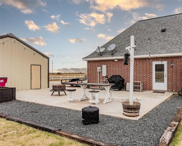 view of patio / terrace with area for grilling and an outdoor fire pit