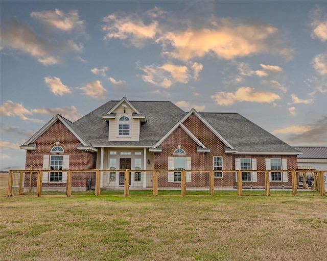 view of front of home featuring a yard