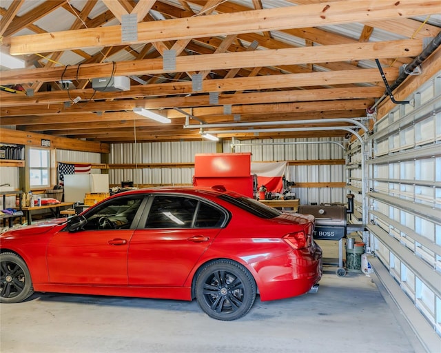 garage featuring a garage door opener and white fridge