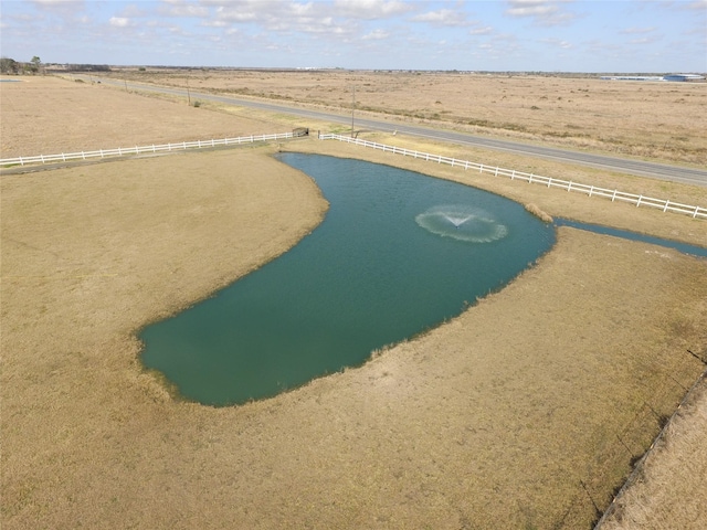 aerial view with a water view and a rural view