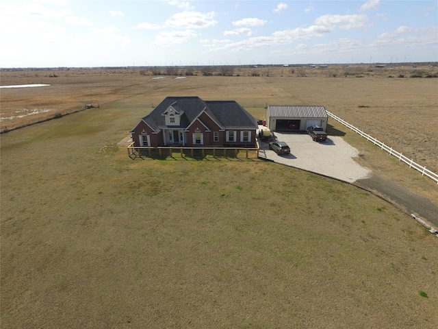 birds eye view of property featuring a rural view