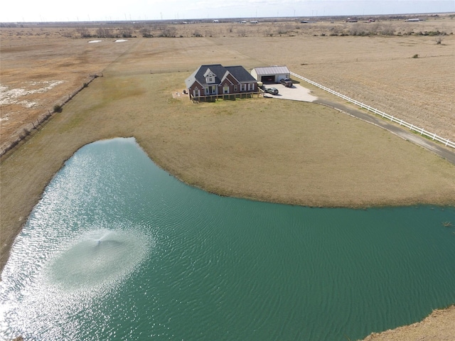 bird's eye view featuring a rural view and a water view