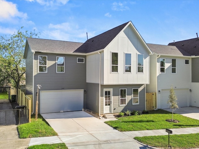 view of front of property with a garage and a front yard