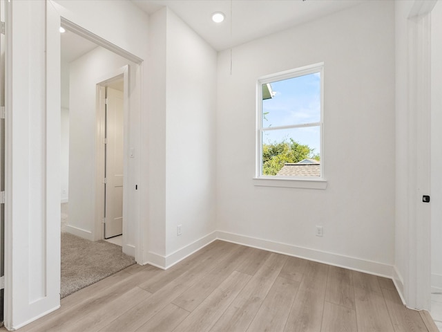 spare room with light hardwood / wood-style flooring