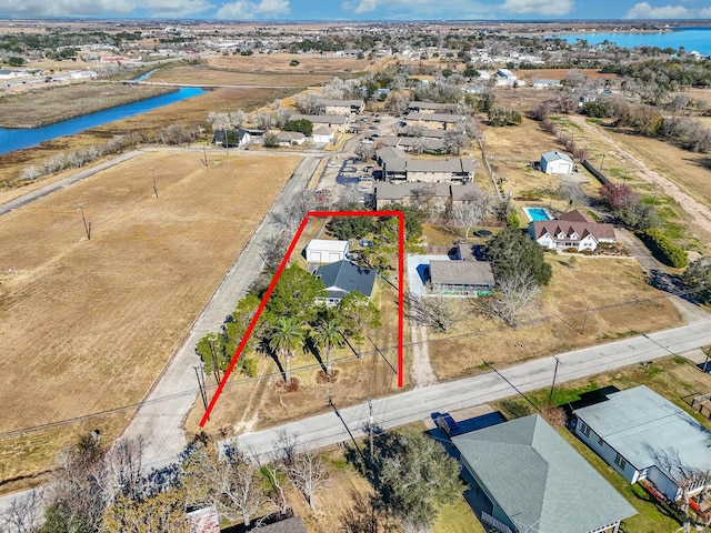 bird's eye view featuring a residential view and a water view