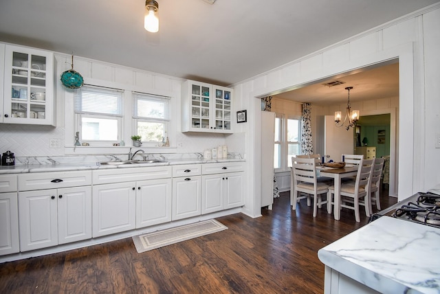 kitchen featuring glass insert cabinets and white cabinetry