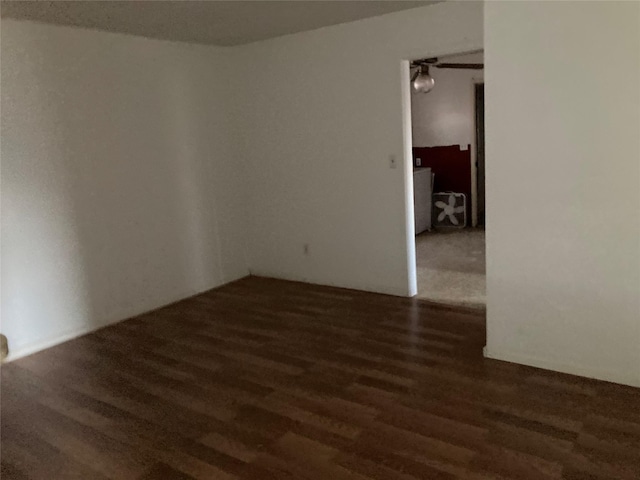 empty room with dark hardwood / wood-style floors