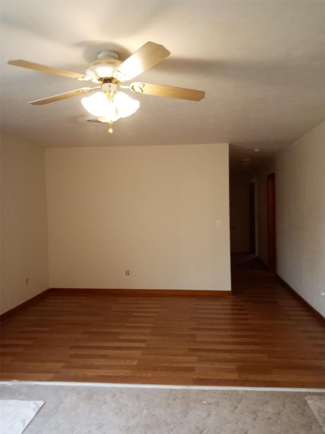 spare room with hardwood / wood-style flooring and ceiling fan