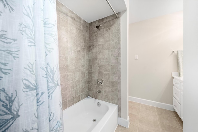 bathroom featuring shower / bath combination with curtain, vanity, and tile patterned flooring